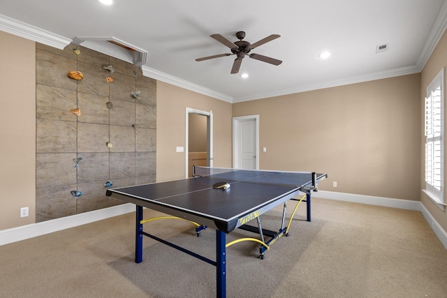 recreation room featuring carpet floors, visible vents, and crown molding