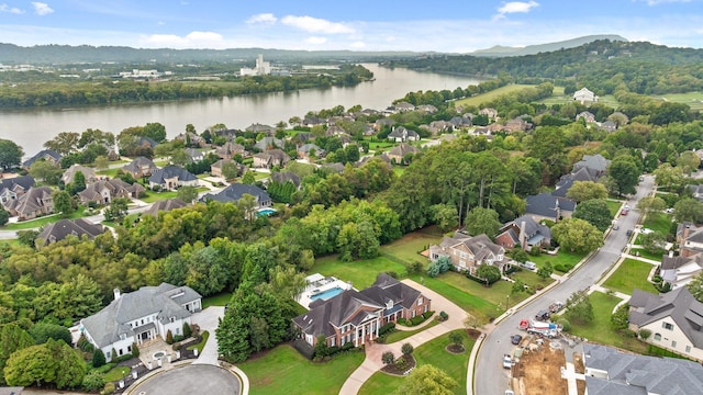 drone / aerial view featuring a water view and a residential view