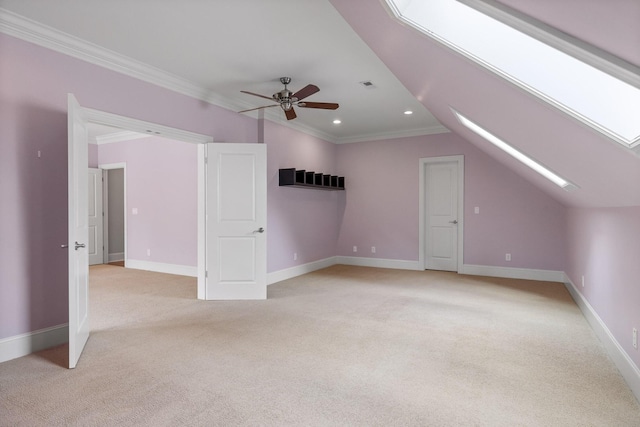 bonus room featuring recessed lighting, light carpet, ceiling fan, vaulted ceiling with skylight, and baseboards