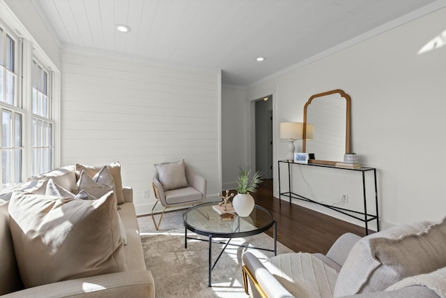 living room featuring recessed lighting, crown molding, and wood finished floors