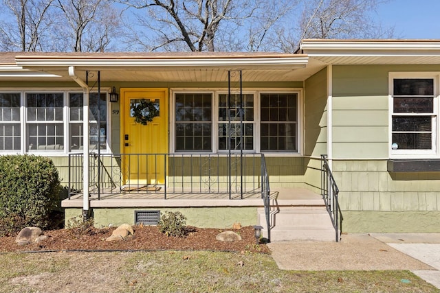 doorway to property featuring crawl space and covered porch