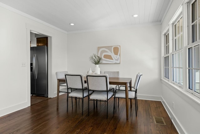 dining room with dark wood-style floors, baseboards, visible vents, and recessed lighting