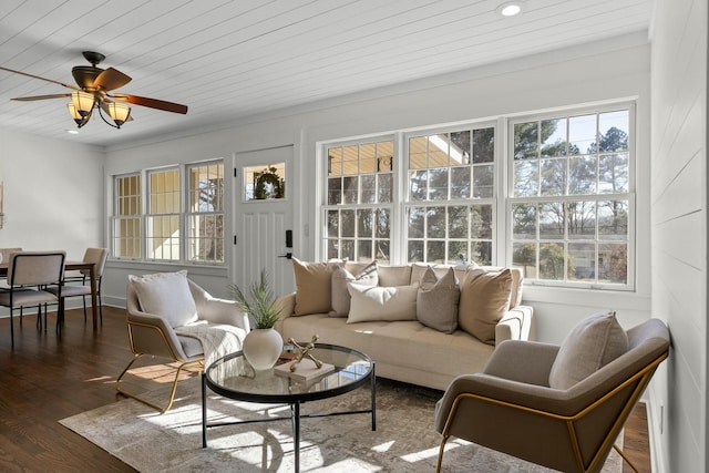 sunroom / solarium featuring plenty of natural light and ceiling fan