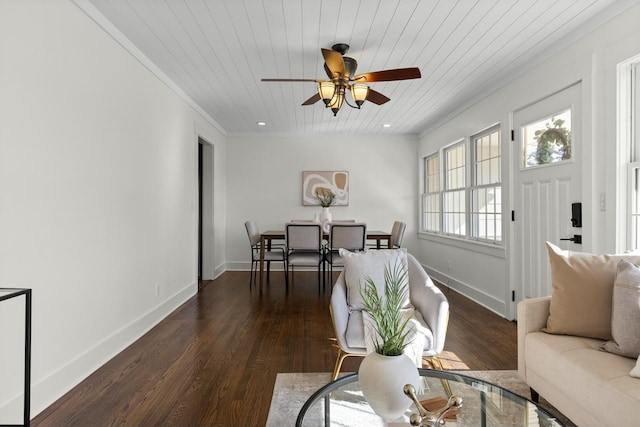 living area featuring baseboards, wooden ceiling, ornamental molding, wood finished floors, and recessed lighting