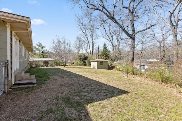 view of yard featuring an outbuilding and entry steps