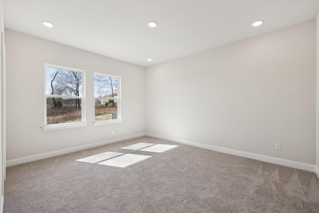 carpeted spare room with recessed lighting and baseboards