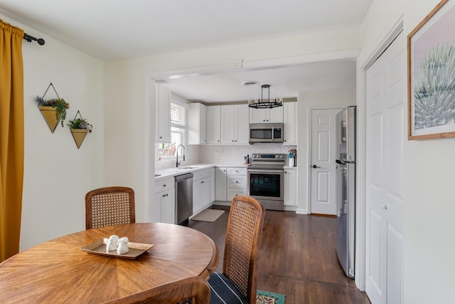 dining space with dark wood-style flooring