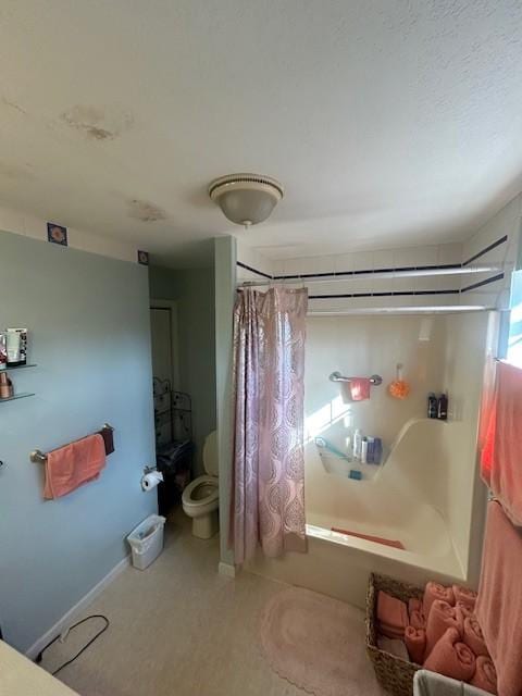 bathroom featuring toilet and shower / bathtub combination with curtain