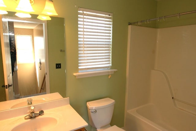 full bathroom featuring shower / bath combination, vanity, and toilet