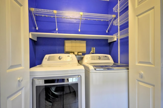 washroom featuring laundry area and independent washer and dryer