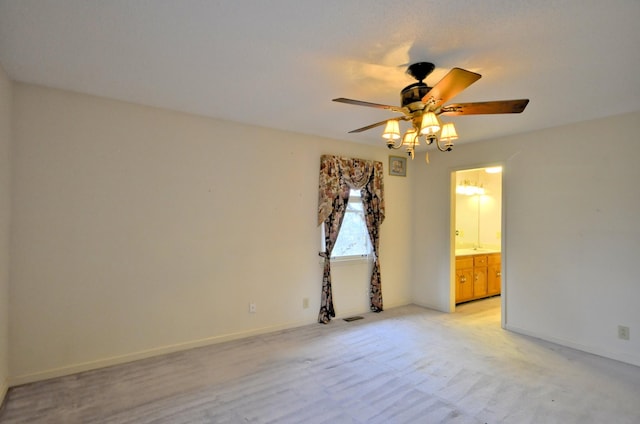 unfurnished room featuring baseboards and a ceiling fan