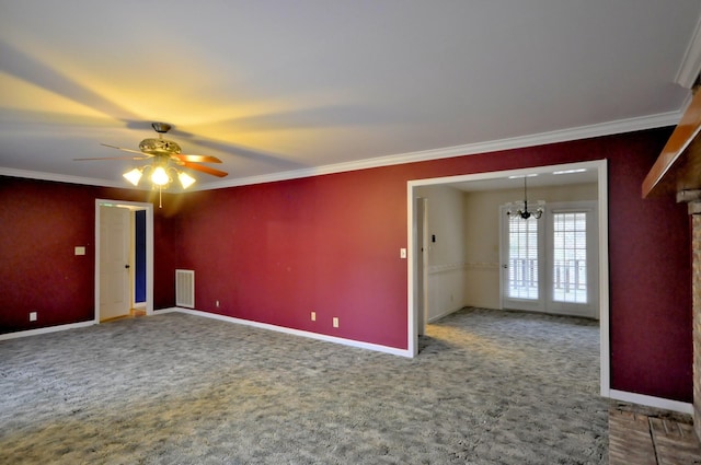 carpeted spare room featuring ornamental molding, visible vents, and baseboards