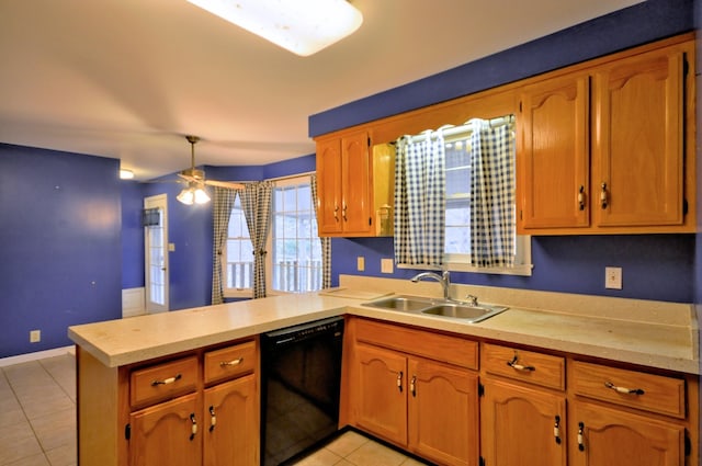 kitchen with light tile patterned floors, light countertops, a sink, dishwasher, and a peninsula