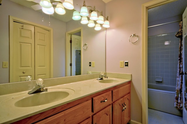 bathroom with shower / tub combo with curtain, a sink, and double vanity