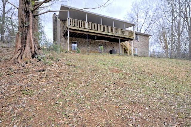 back of property featuring a deck