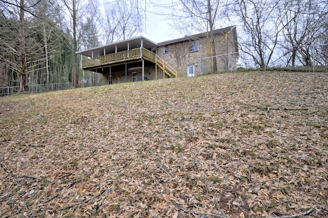 back of house featuring a wooden deck