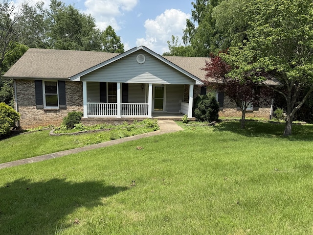 2405 Chris Dr, Clarksville, TN 37043 - ranch-style house with roof with shingles, covered porch, and a front yard