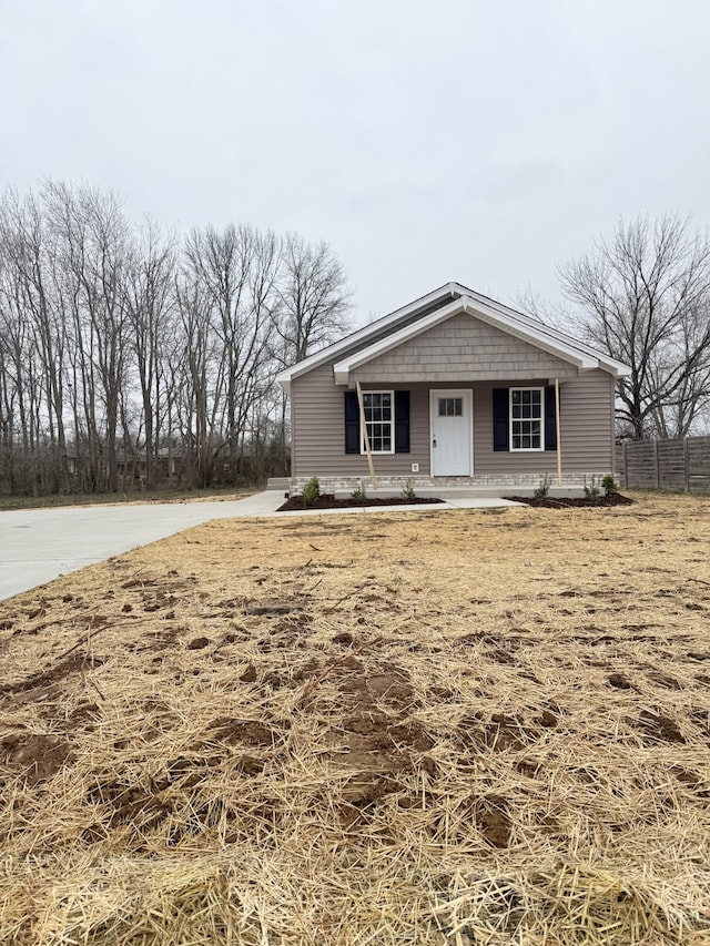 view of front of home featuring fence