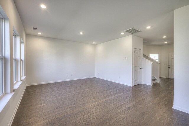 spare room with visible vents, dark wood-style flooring, and recessed lighting