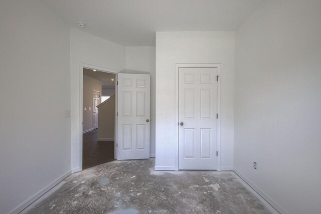 unfurnished bedroom with baseboards