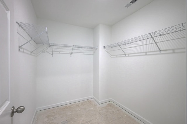 walk in closet with visible vents