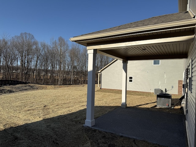 view of yard with central AC