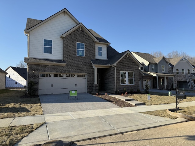 view of front facade featuring driveway, a garage, and brick siding