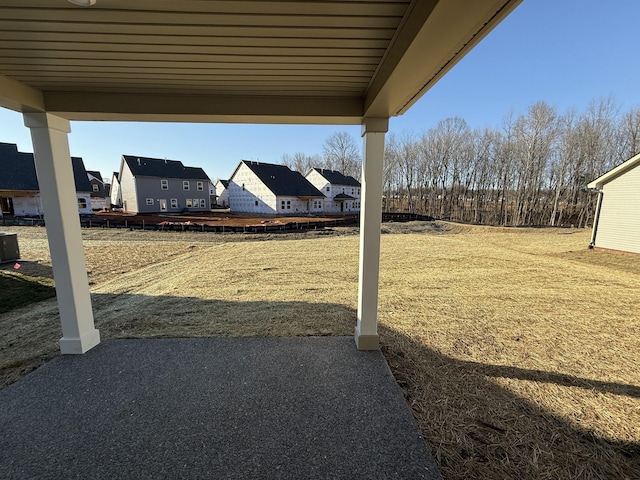 view of yard with a patio and a residential view