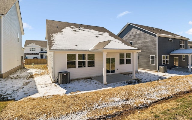 back of property featuring central air condition unit, fence, and a patio