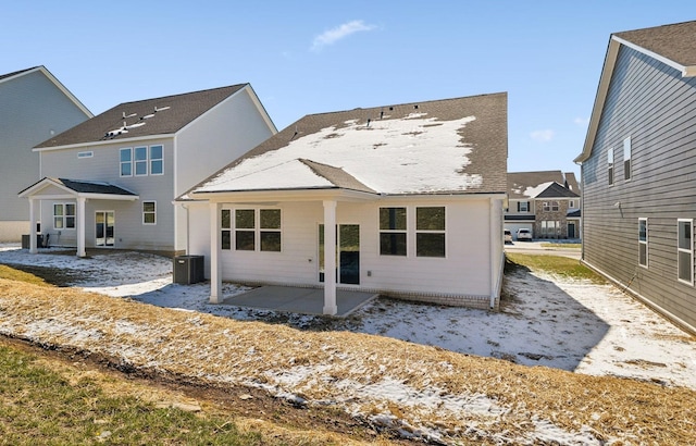 back of house with central AC and a patio