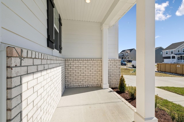 entrance to property with a residential view and brick siding