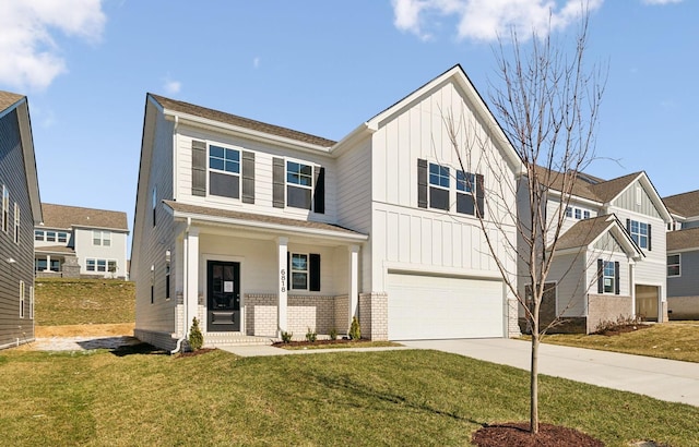 modern farmhouse featuring a garage, brick siding, concrete driveway, a front lawn, and board and batten siding