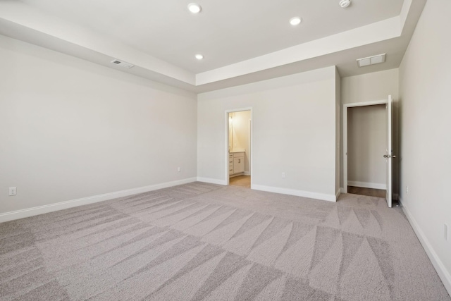 unfurnished bedroom with recessed lighting, visible vents, light carpet, and baseboards