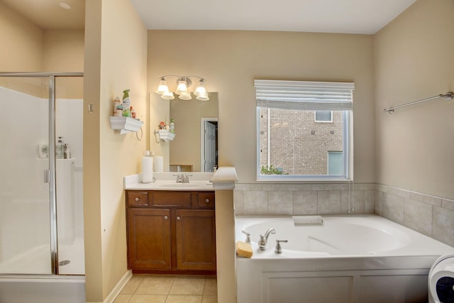 full bathroom featuring tile patterned flooring, a shower stall, vanity, and a bath