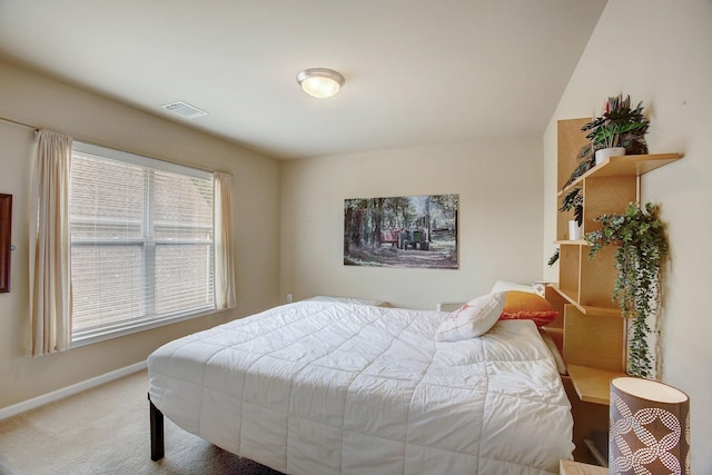 bedroom with baseboards, visible vents, and carpet flooring