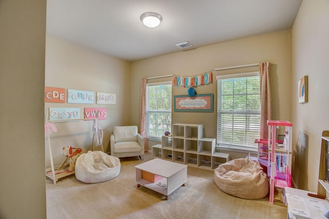 rec room with carpet and visible vents