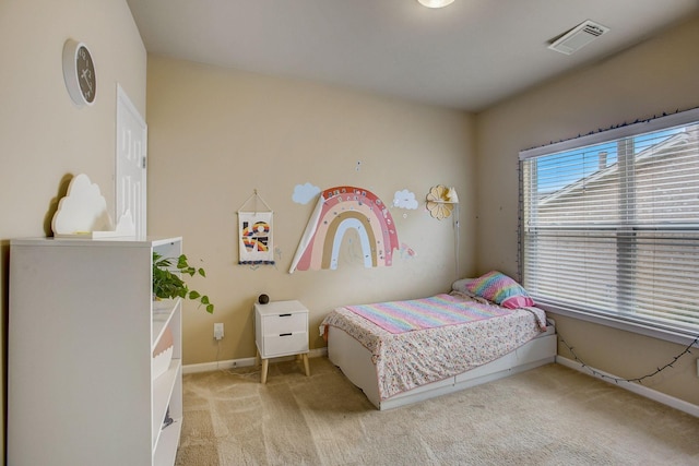 bedroom with light carpet, visible vents, and baseboards