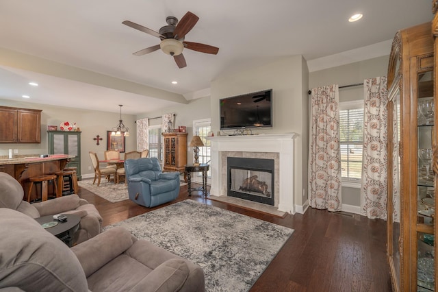 living room featuring baseboards, a tiled fireplace, dark wood-style floors, ceiling fan, and recessed lighting