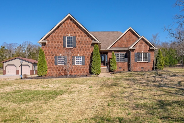 view of front of property featuring a garage, brick siding, an outdoor structure, crawl space, and a front lawn