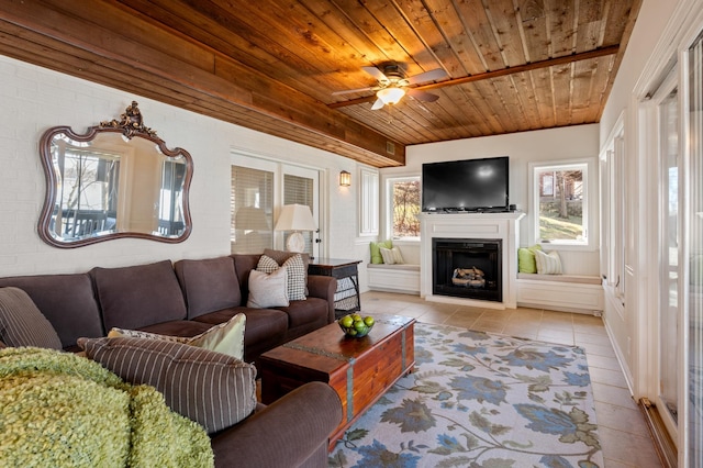 living room with a wealth of natural light, wooden ceiling, a fireplace, and light tile patterned floors