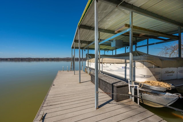 dock area featuring a water view and boat lift