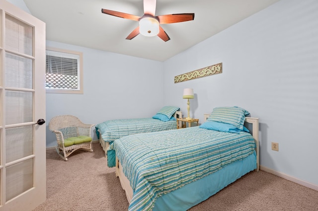 bedroom with carpet, ceiling fan, and baseboards