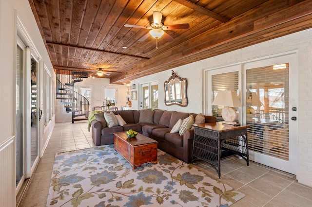 living area featuring wood ceiling, stairs, ceiling fan, and tile patterned floors