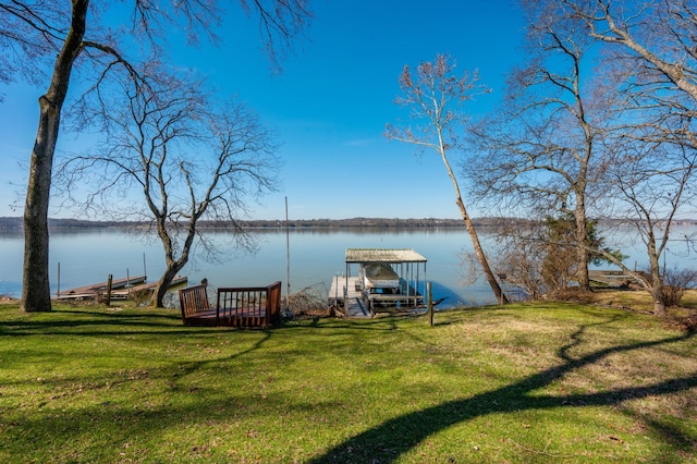 view of dock featuring a yard and a water view