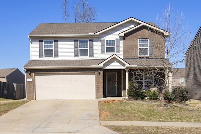 view of front facade with brick siding, fence, driveway, and an attached garage