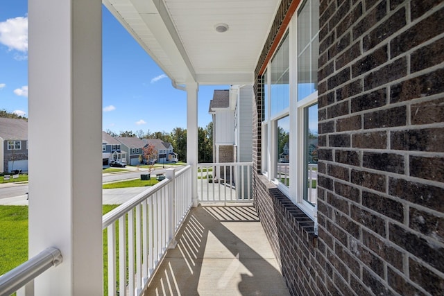 balcony with a residential view and covered porch