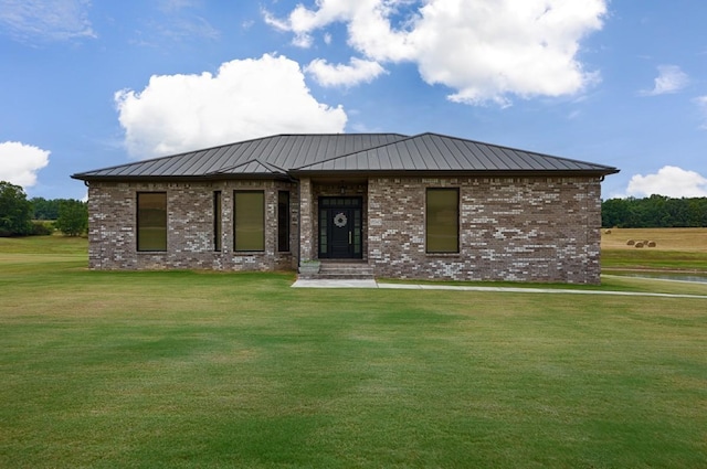 18543 Tillman Mill Rd, Athens, AL 35614 - view of front facade with a standing seam roof, brick siding, metal roof, and a front lawn
