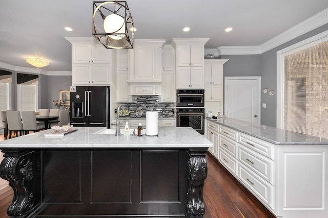 18543 Tillman Mill Rd, Athens, AL 35614 - kitchen with a large island, crown molding, black appliances, white cabinetry, and a sink