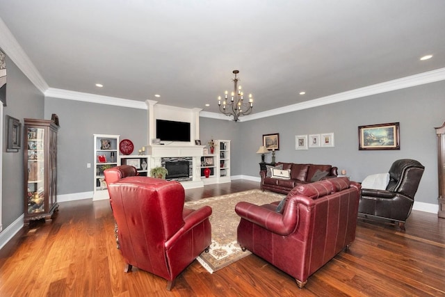 18543 Tillman Mill Rd, Athens, AL 35614 - living room featuring a chandelier, a fireplace with raised hearth, baseboards, and wood finished floors
