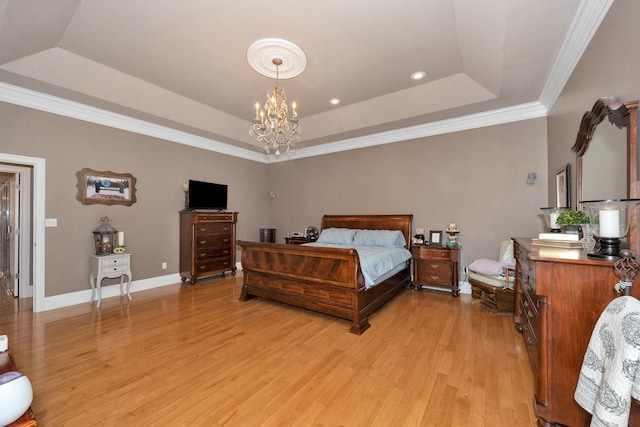 18707 Tillman Mill Rd, Athens, AL 35614 - bedroom with light wood-type flooring, baseboards, a tray ceiling, and a notable chandelier